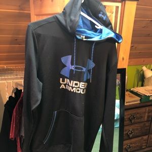 Woman’s black/blue Under Armour hoodie.